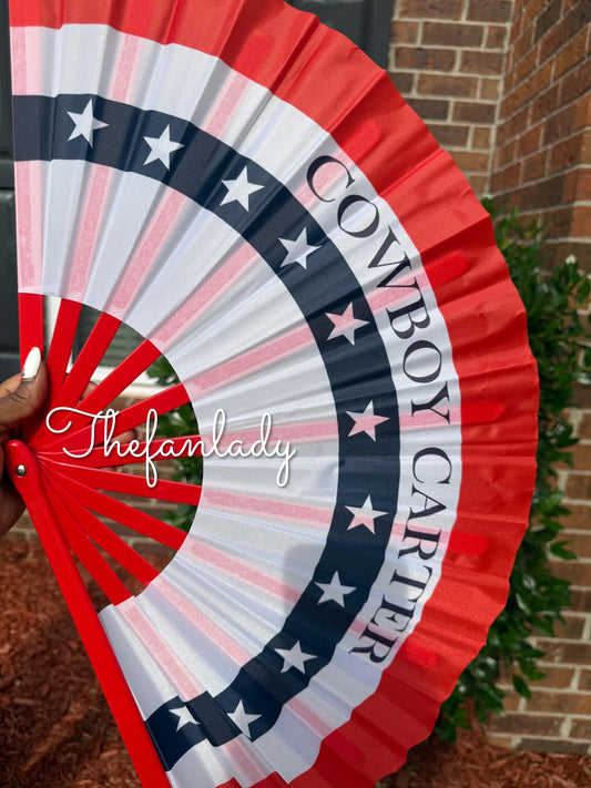 Cowboy Carter themed folding hand fan with patriotic red white and blue star print design, perfect concert accessory or party gift